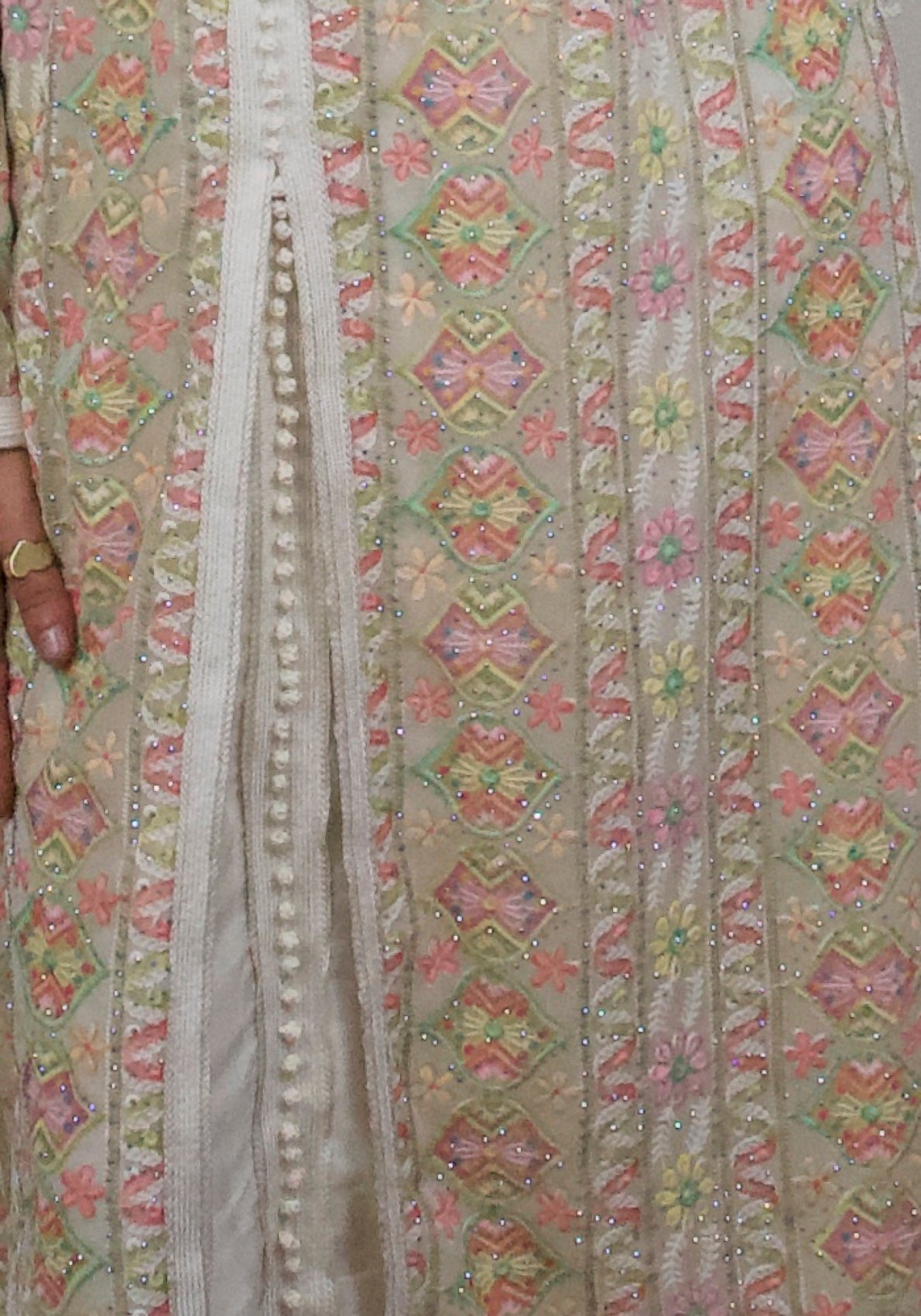 Caftan Rym — detail of the braided trim, covered ball buttons and hand-set crystals