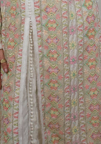 Caftan Rym — detail of the braided trim, covered ball buttons and hand-set crystals