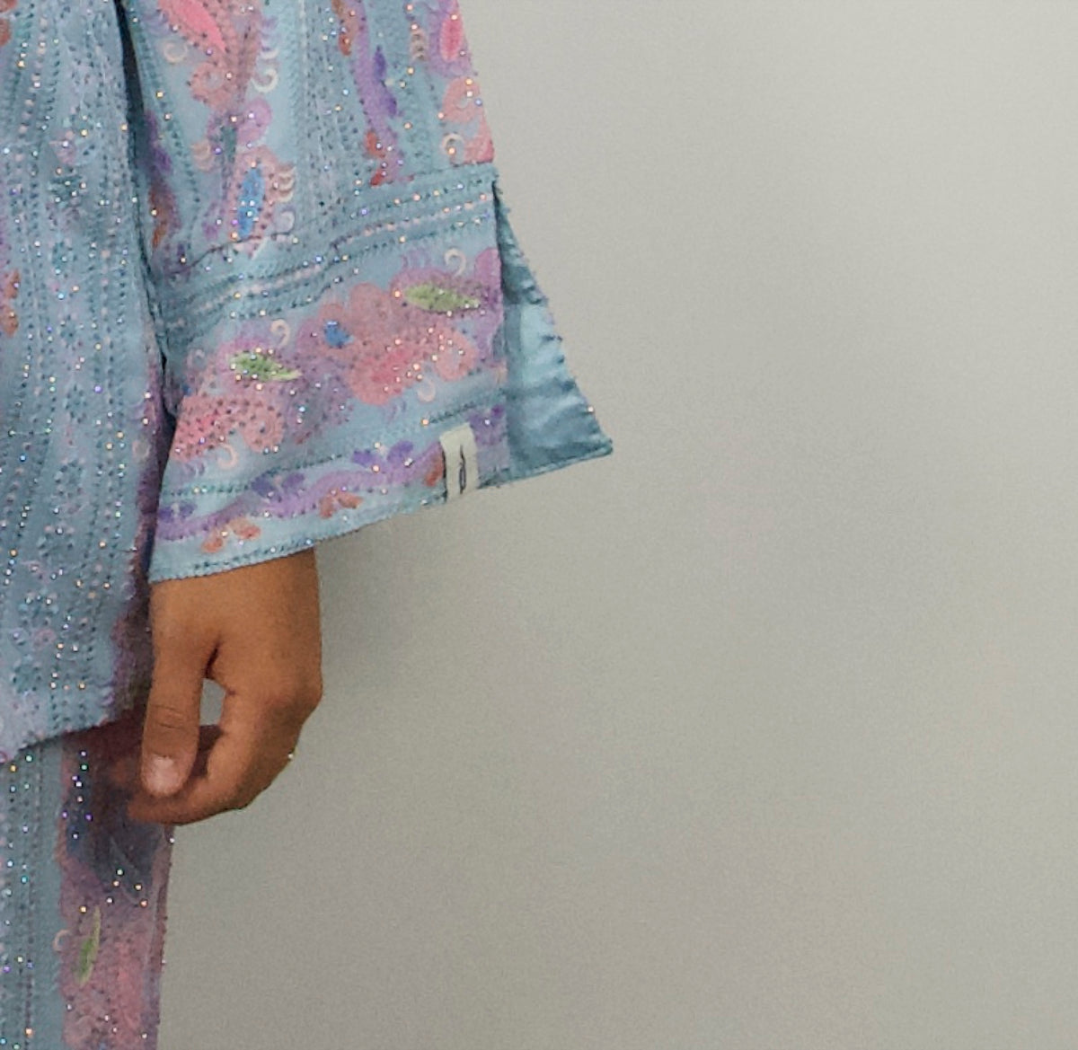 Set Sirine — detail of the split cuff, embroidered band and hand-set crystals